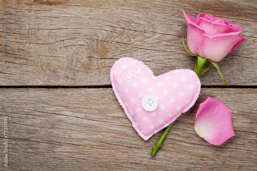 Fototapeta Naklejka Na Ścianę i Meble -  Valentines day background with pink rose and handmaded toy heart