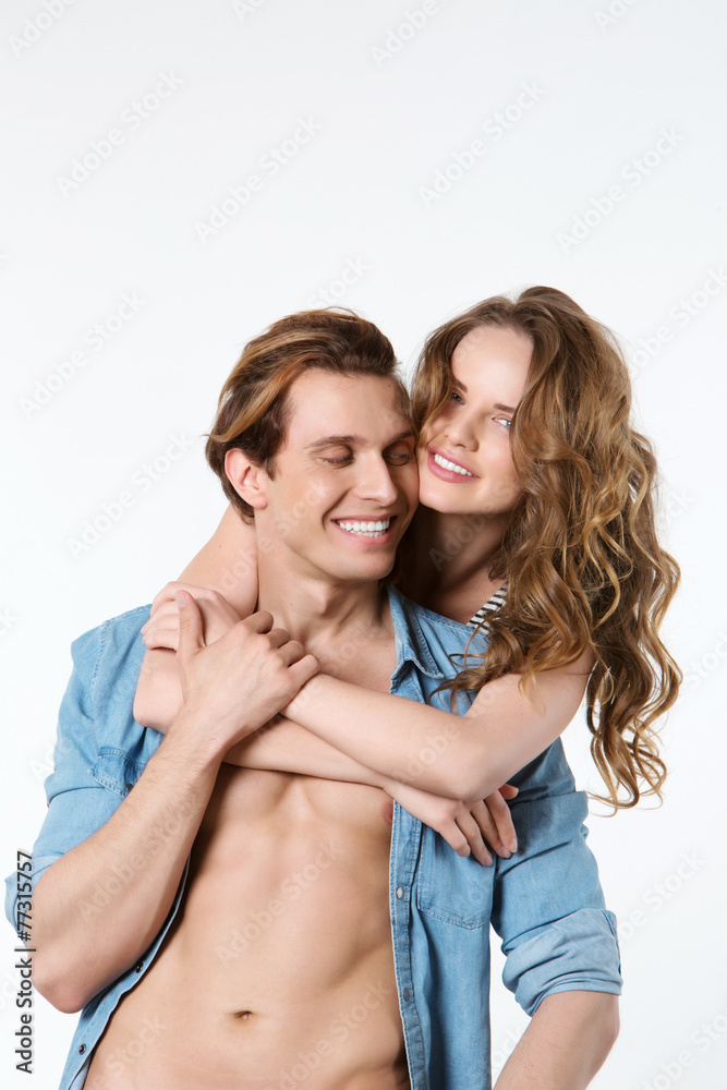 Funny couple laughing with a white perfect smile shot in studio Funny couple laughing with a white perfect smile shot in studio