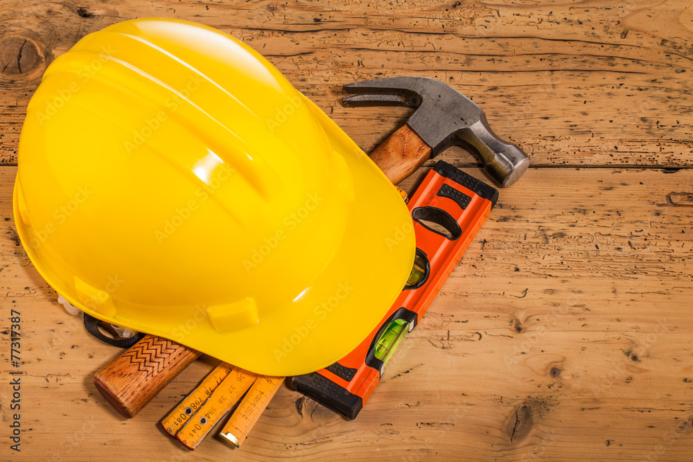 Fototapeta premium yellow helmet and wood mounting tools