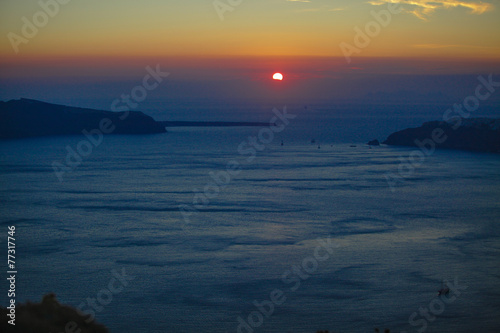 Famous sunset above Caldera view over sea in Santorini Island