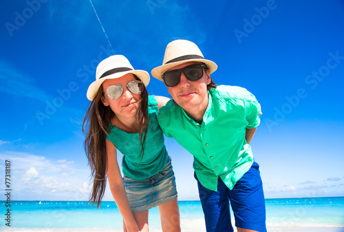 Young happy couple during tropical beach vacation
