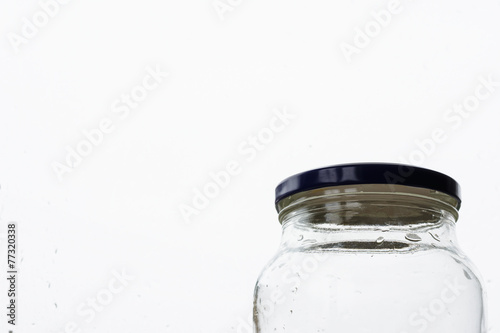 Glass jar in front of the window