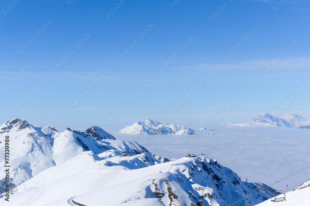 View on mountains and blue sky above clouds View on mountains and blue sky above clouds