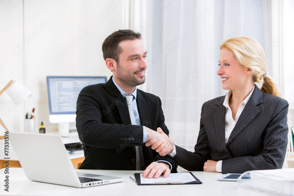 Business man finalising agreement at the office Business man finalising agreement at the office