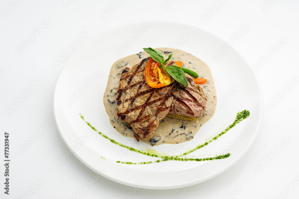 Grilled steak on white plate Grilled steak on white plate