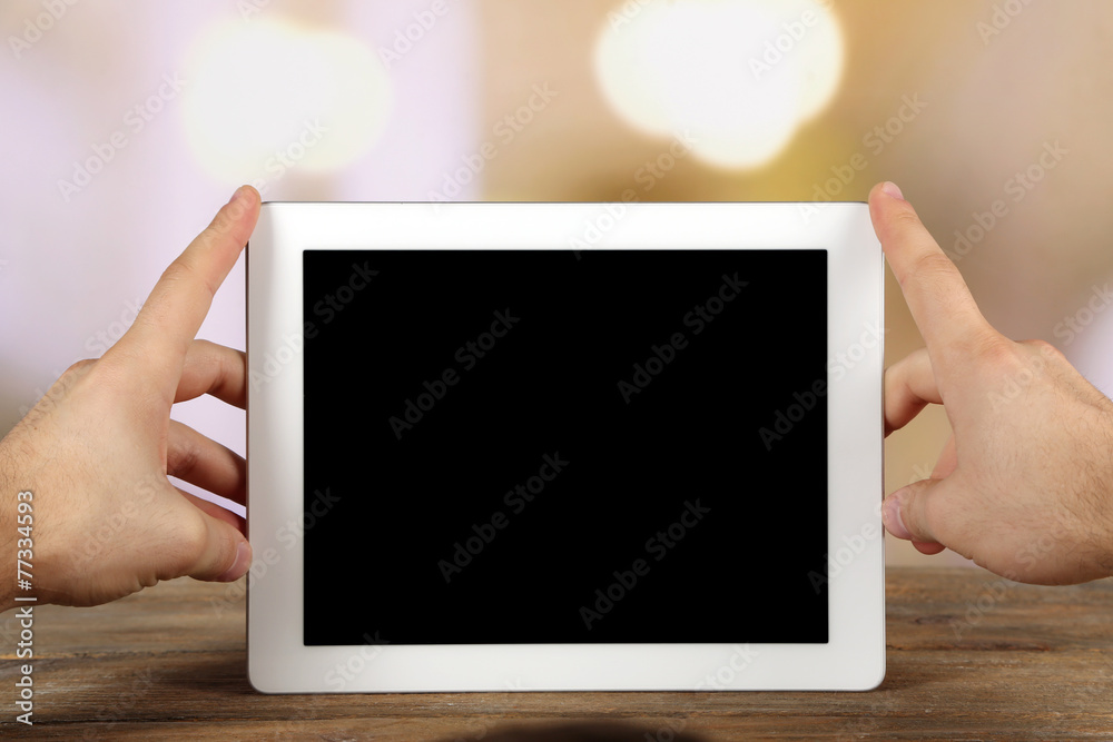 Hands holding tablet PC