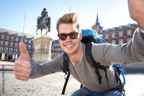 backpacker tourist taking selfie photo mobile phone outdoors photo