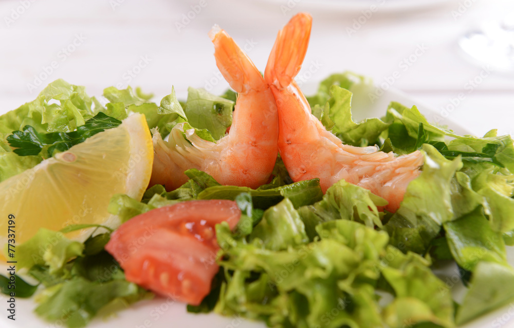 Tasty seafood on plate on table close-up Tasty seafood on plate on table close-up