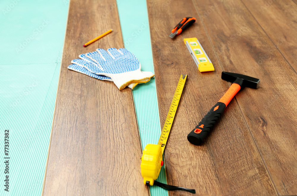 Carpenter tools on new laminate floor