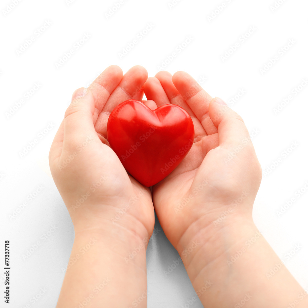 Heart in child hands isolated on white Heart in child hands isolated on white