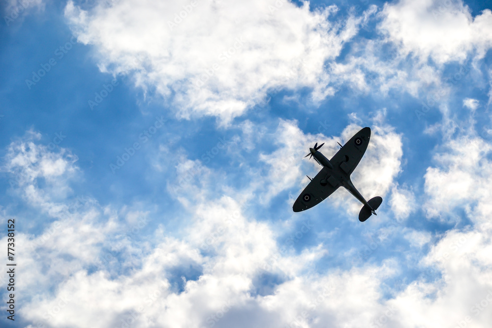 Spitfire on blue cloudy sky over Bratislava Spitfire on blue cloudy sky over Bratislava