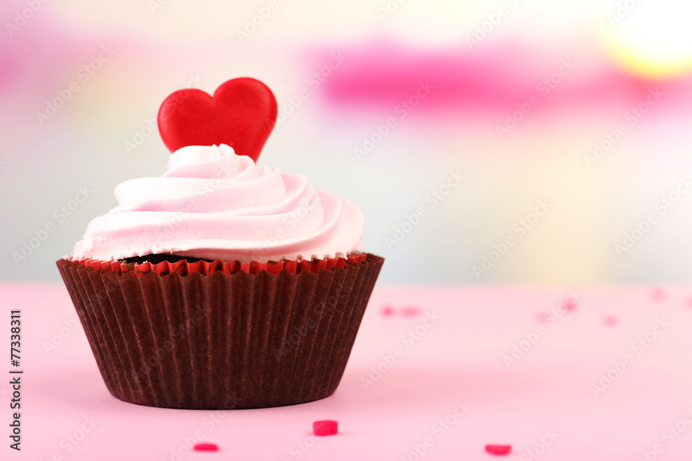 Delicious cupcake for Valentine Day on bright background