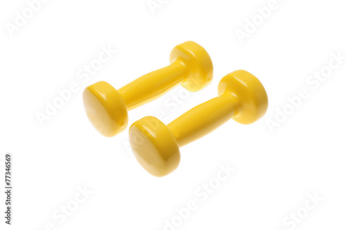 Pair of yellow dumbbells Isolated on white background