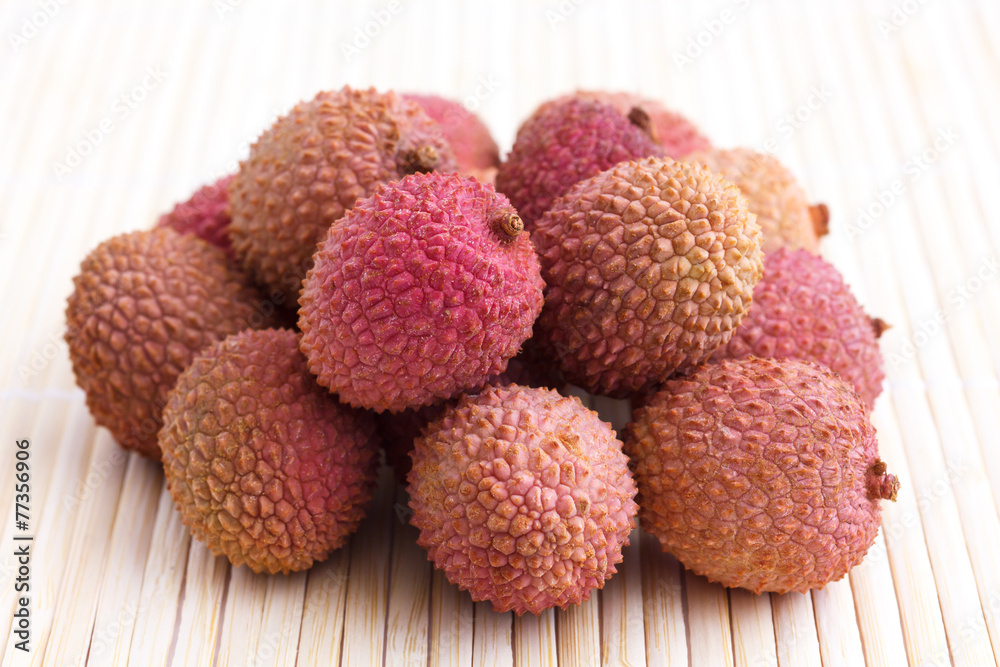 Bunch of litchis on bamboo matt. Bunch of litchis on bamboo matt.