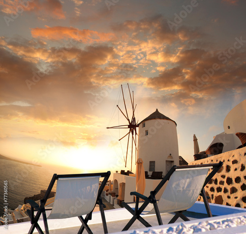Windmill against colorful sunset, Santorini, Greece