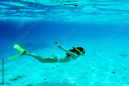 Woman with mask snorkeling