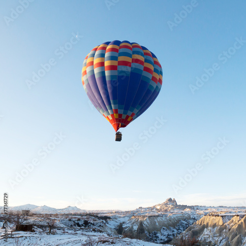 Hot air balloons fly over Cappadocia.