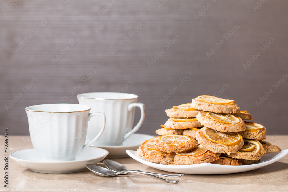 cups of tea with almond biscuits with lemon cups of tea with almond biscuits with lemon