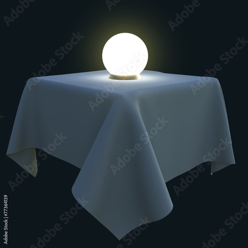Glowing magic ball on a square table.