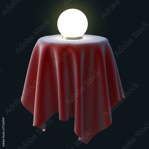 Glowing crystal ball on a round table.