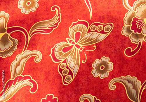 Obraz na płótnie Close-up Butterfly pattern on red batik