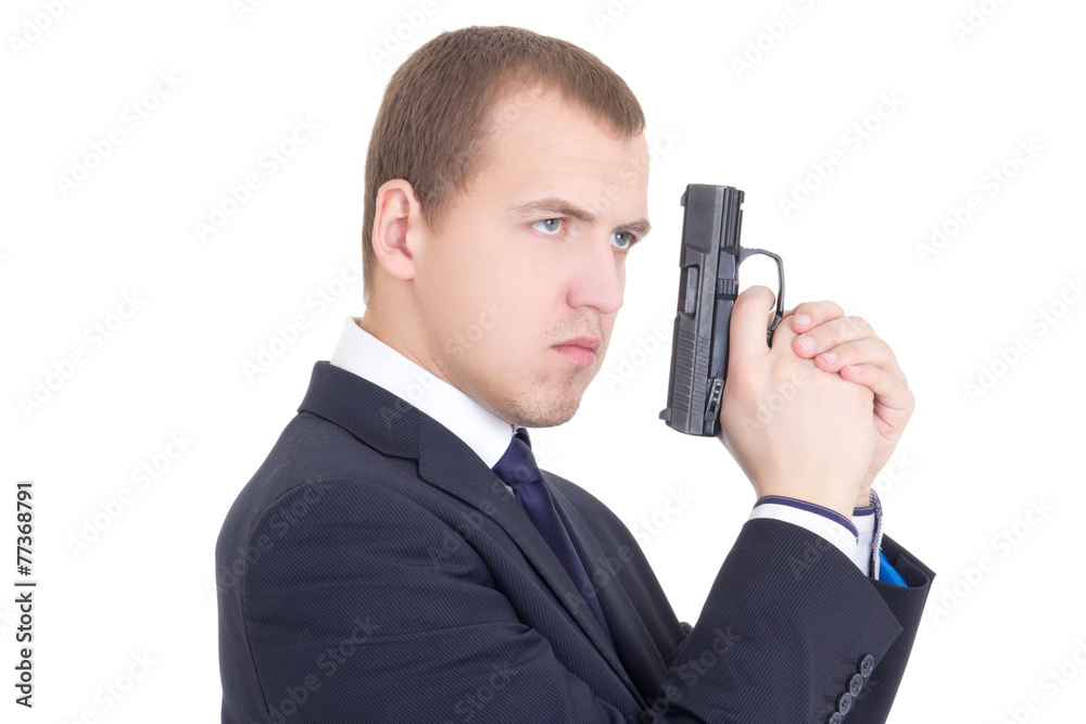 portrait of serious man in business suit with gun isolated on wh portrait of serious man in business suit with gun isolated on wh
