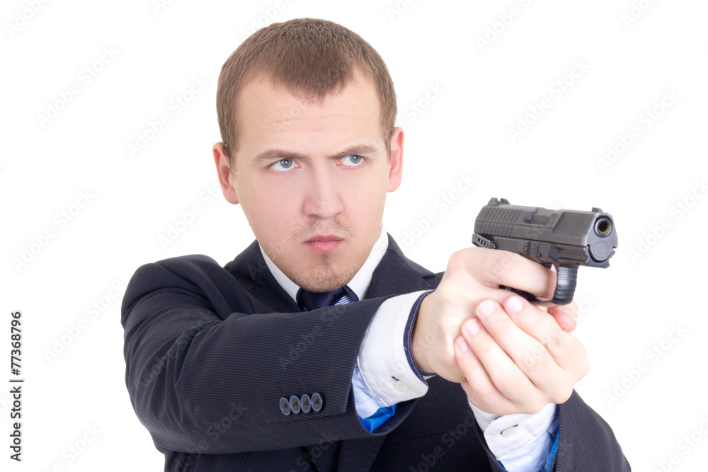serious man in business suit shooting with gun isolated on white serious man in business suit shooting with gun isolated on white