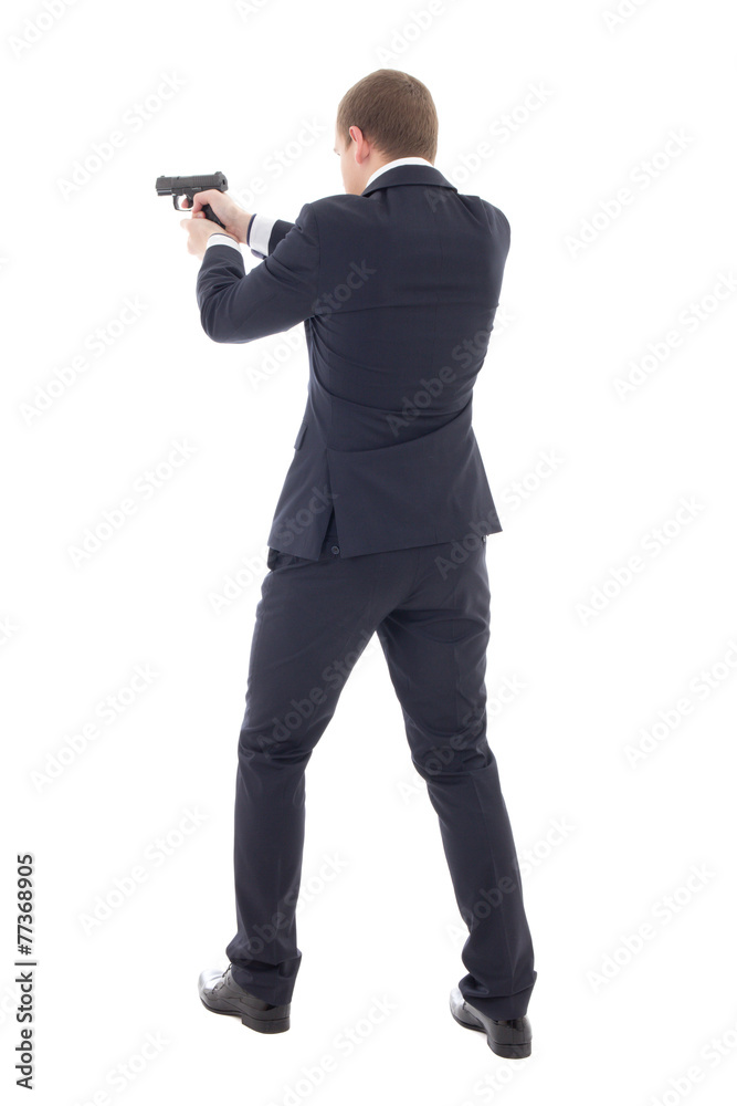 back view of special agent man in business suit posing with gun back view of special agent man in business suit posing with gun