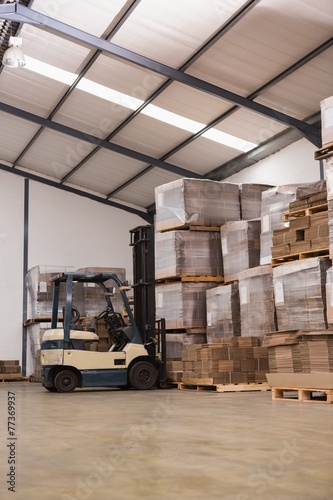 Forklift in a large warehouse