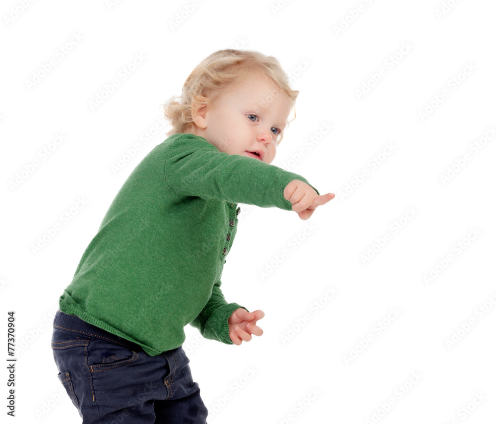 Adorable blond baby indicating something