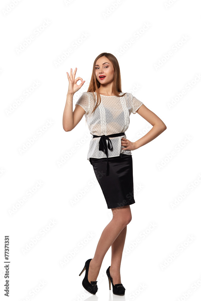 Young attractive female with thumbs-up and OK gesture isolated o Young attractive female with thumbs-up and OK gesture isolated o