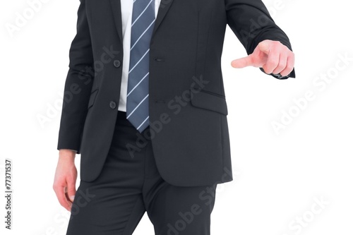 Mid section businessman pointing with his finger © WavebreakmediaMicro