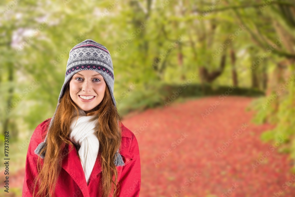 Composite image of pretty redhead in warm clothing