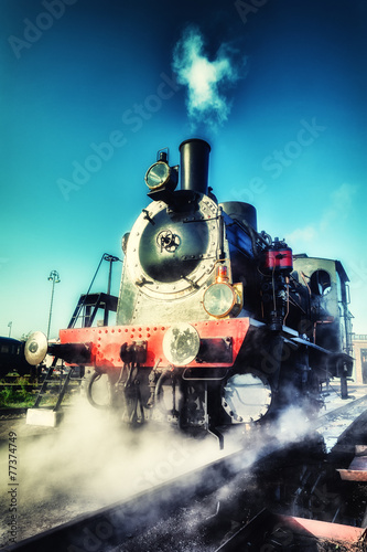 Historical steam engine train in motion