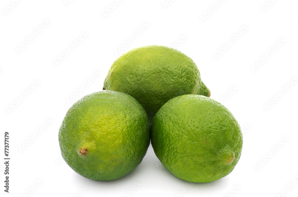 Limes with slices and leaves isolated on white background Limes with slices and leaves isolated on white background