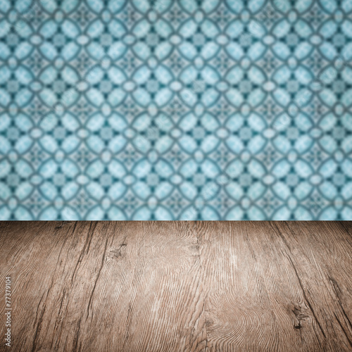 Fototapeta Naklejka Na Ścianę i Meble -  Wood table top and blur vintage ceramic tile pattern wall