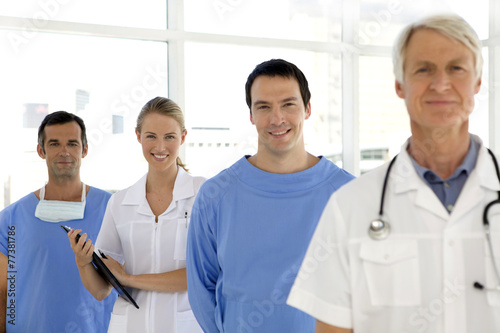 Medical team standing in a row with senior leader