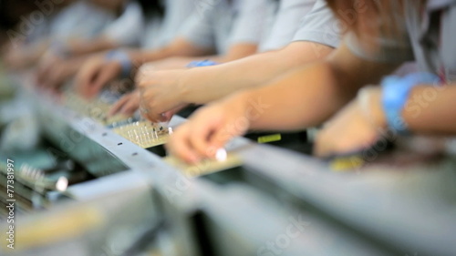 PCBs being assembled by  factory workers, China, Time lapse
