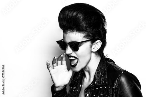 Rocker girl wearing sunglasses half profile black and white