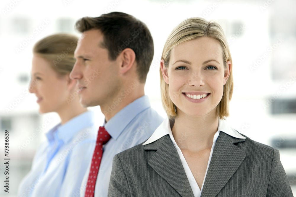 Young business team standing in a row with selective focus Young business team standing in a row with selective focus