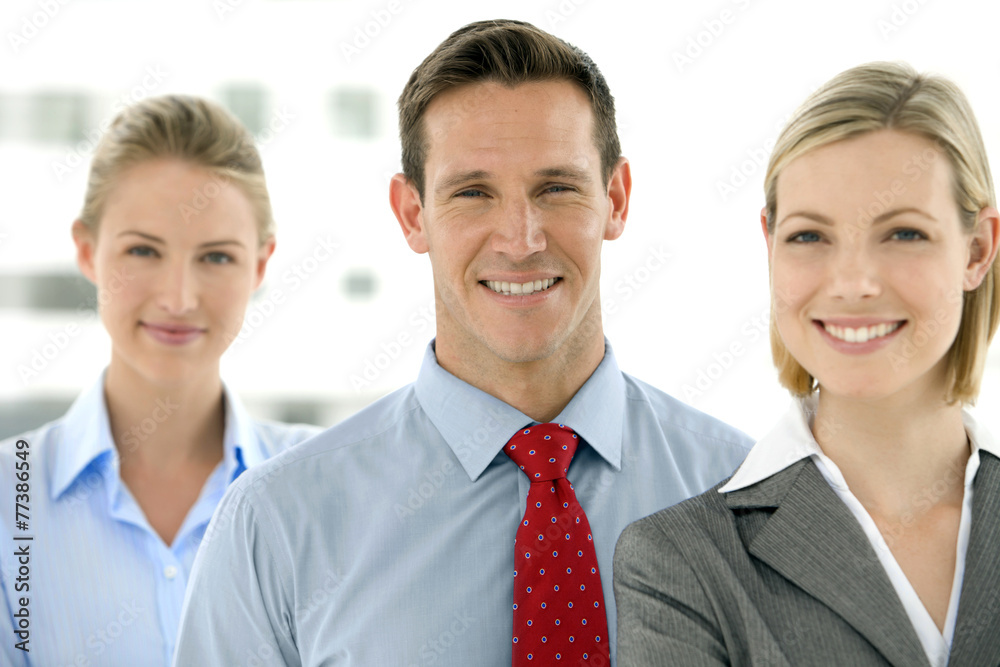 Young business team standing in a row with selective focus Young business team standing in a row with selective focus