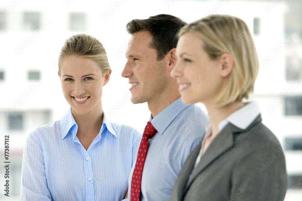 Young business team standing in a row with selective focus Young business team standing in a row with selective focus
