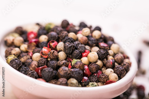 Red pepper, peppercorns in bowl. hot spices 
