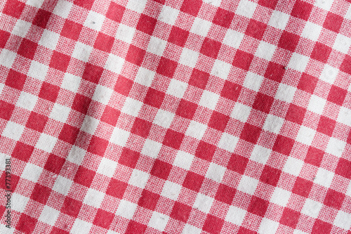 Texture of a red and white checkered tablecloth.