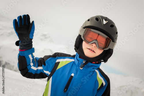 Young skier on winter background