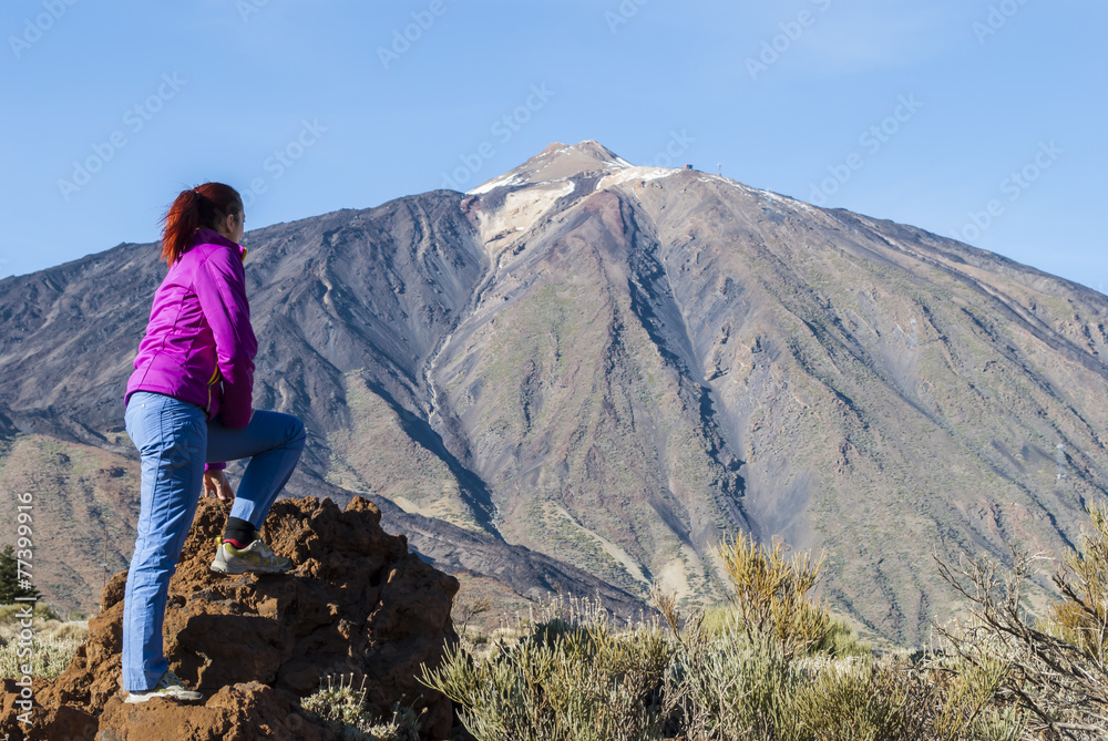Fototapeta premium Young woman by the volcano