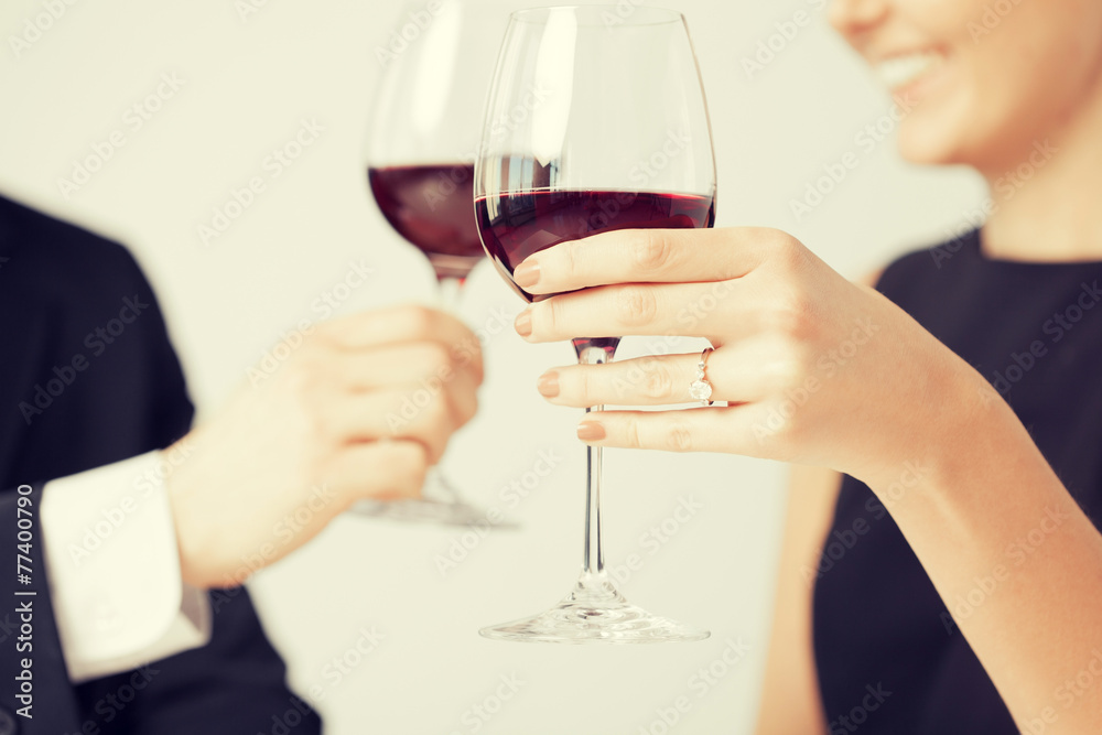 engaged couple with wine glasses engaged couple with wine glasses