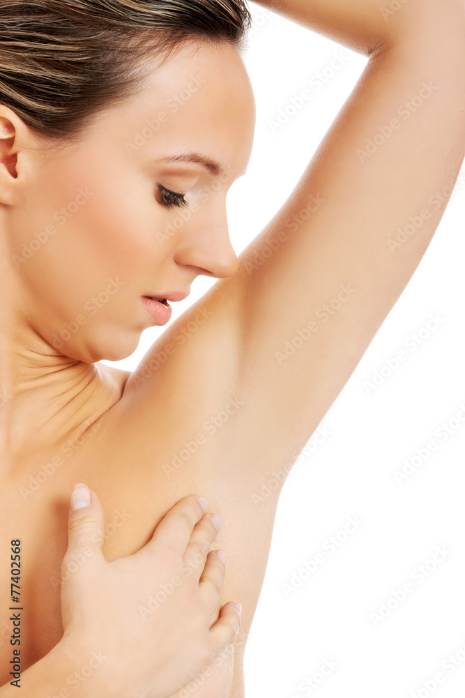 Beautiful and topless woman is touching her armpit. Beautiful and topless woman is touching her armpit.