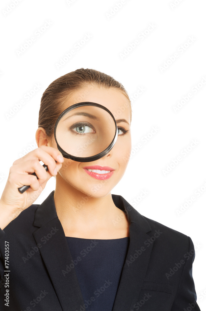 Businesswoman with magnifying glass. Businesswoman with magnifying glass.