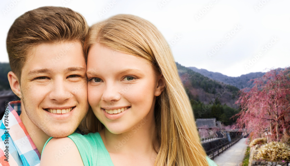 Obraz premium smiling couple over asian landscape background